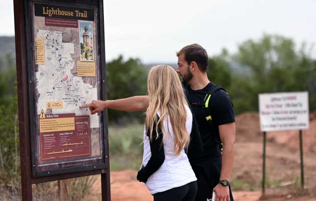 Couple planning route on map